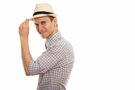 Portrait of young handsome tourist man wearing hatの写真素材