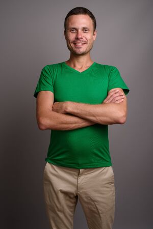 Portrait of handsome man against gray backgroundの写真素材