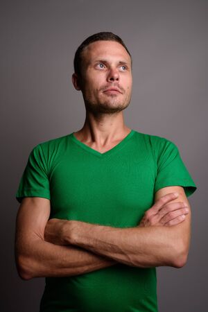 Portrait of handsome man against gray backgroundの写真素材