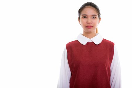 Studio shot of young Asian woman looking at cameraの写真素材