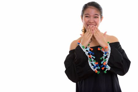 Studio shot of young Asian woman against white backgroundの写真素材