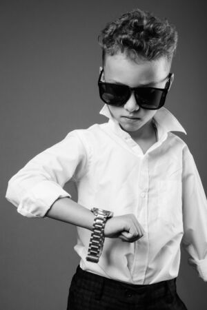 Young boy as businessman in black and whiteの写真素材