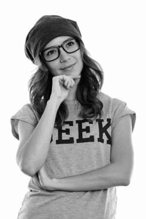 Studio shot of geek girl thinking while looking upの写真素材