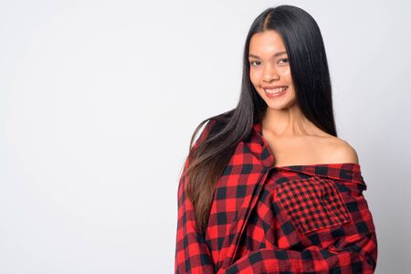 Face of happy young beautiful Asian hipster woman smilingの写真素材