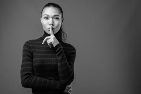 Young beautiful Asian transgender woman in black and whiteの写真素材