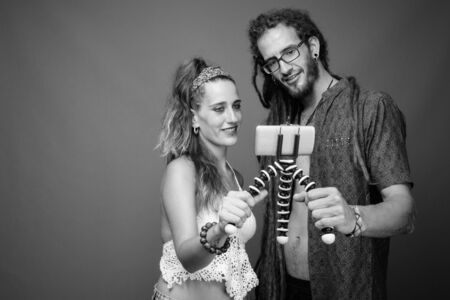 Studio shot of young Hispanic couple together in black and white