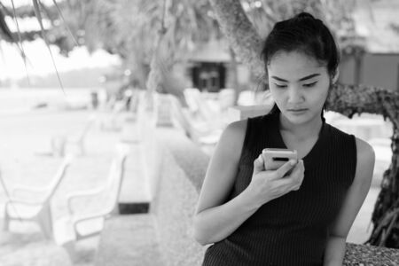 Young beautiful Asian tourist woman enjoying vacationの写真素材