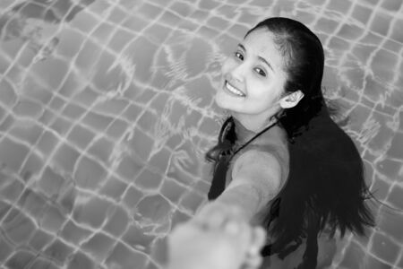 Young beautiful Asian tourist woman enjoying vacationの写真素材