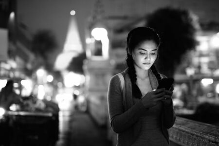 Young beautiful Asian tourist woman exploring Nakhon Pathom province in Thailandの写真素材