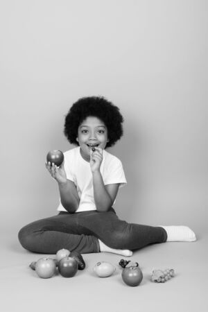 Young cute African girl with Afro hair in black and whiteの写真素材