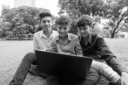 Portrait of Indian family relaxing together at the park