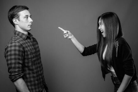 Portrait of young multi ethnic couple together in black and whiteの写真素材