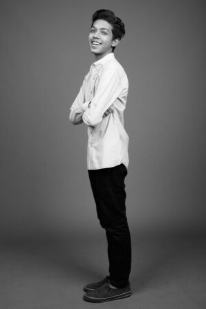 Young Indian boy looking smart in black and whiteの写真素材