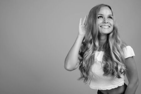 Young beautiful woman with blond hair in black and whiteの写真素材