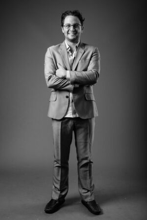 Studio shot of Italian businessman in black and whiteの写真素材