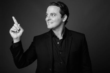 Studio shot of Italian businessman in black and whiteの写真素材