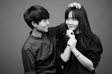 Young Asian lesbian couple together and in loveの写真素材