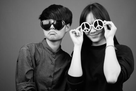 Young Asian lesbian couple together and in loveの写真素材