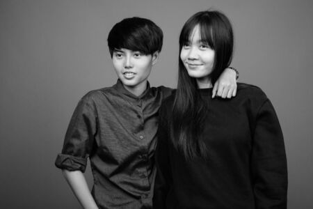Young Asian lesbian couple together and in loveの写真素材