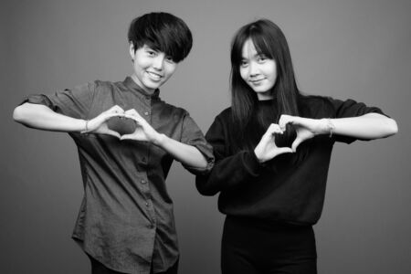 Young Asian lesbian couple together and in loveの写真素材