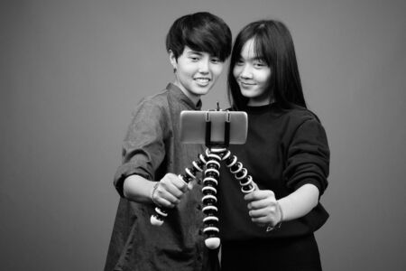 Young Asian lesbian couple together and in loveの写真素材