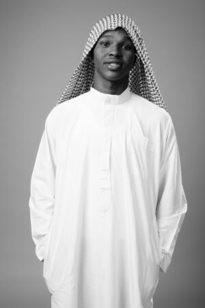 Young African man wearing traditional Muslim clothesの写真素材