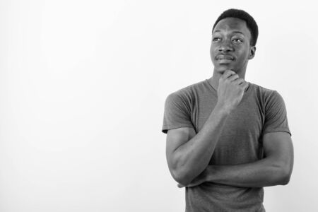 Young handsome African man against white backgroundの写真素材