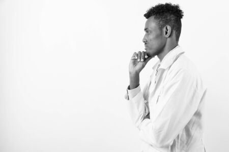 Young bearded African man doctor against white backgroundの写真素材