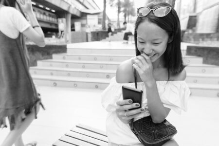 Young beautiful tourist woman exploring the city of Bangkok