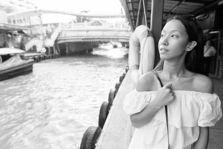 Young beautiful tourist woman exploring the city of Bangkok