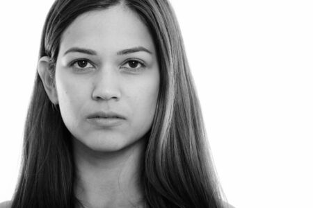 Face of young beautiful woman in black and white