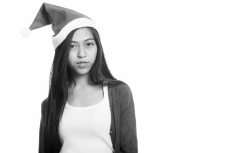 Studio shot of young Asian teenage girl ready for Christmasの写真素材