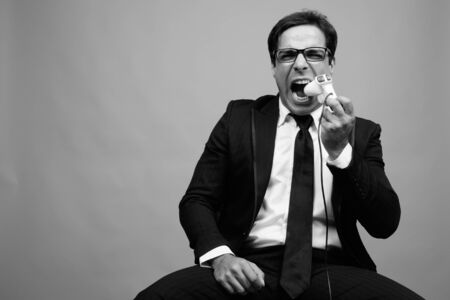 Portrait of handsome Persian businessman in suitの写真素材