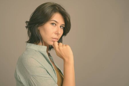 Portrait of young beautiful woman with short hairの写真素材