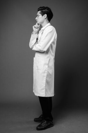 Portrait of young handsome man doctor with eyeglassesの写真素材