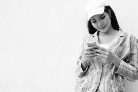 Young beautiful Asian tourist woman exploring the cityの写真素材