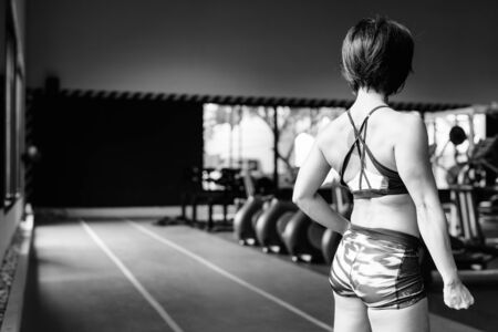 Young beautiful Asian woman working out at the gymの写真素材