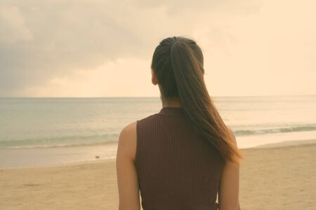 Portrait of young beautiful Asian tourist woman enjoying vacation at Koh Lanta island in Thailandの写真素材