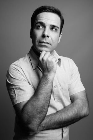 Portrait of handsome Persian man in black and whiteの写真素材