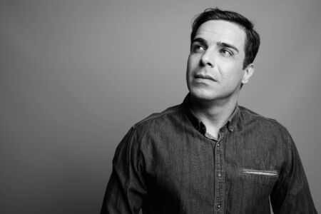 Portrait of handsome Persian man in black and white