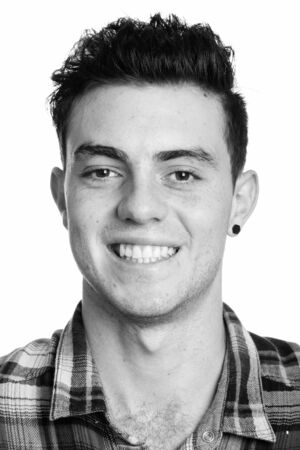 Portrait of young handsome hipster man in black and white