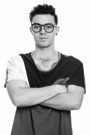 Studio shot of young man with arms crossedの写真素材