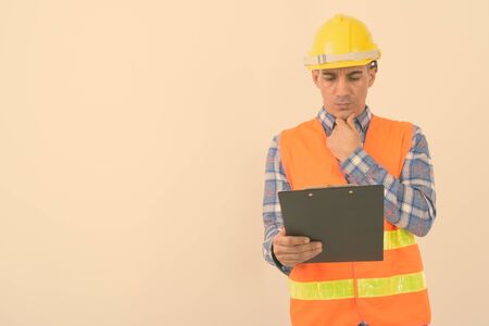 Portrait of mature Persian man construction workerの写真素材