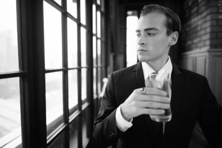 Young handsome businessman in suit exploring the cityの写真素材