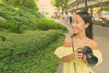 Young beautiful tourist woman exploring the cityの写真素材