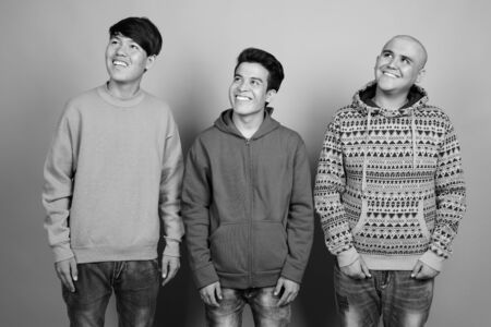 Portrait of three young Asian men togetherの写真素材