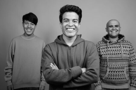 Portrait of three young Asian men togetherの写真素材