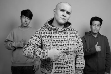 Portrait of three young Asian men together