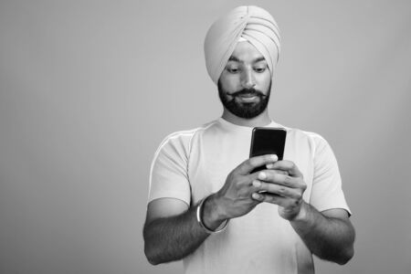 Young bearded Indian Sikh man wearing turbanの写真素材