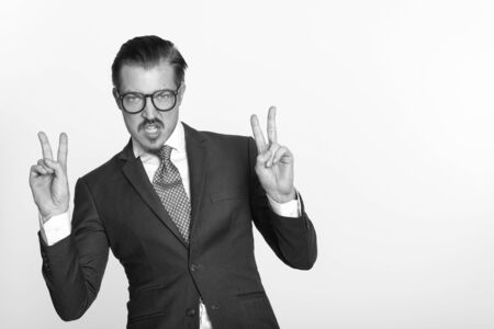 Portrait of young handsome man with mustacheの写真素材